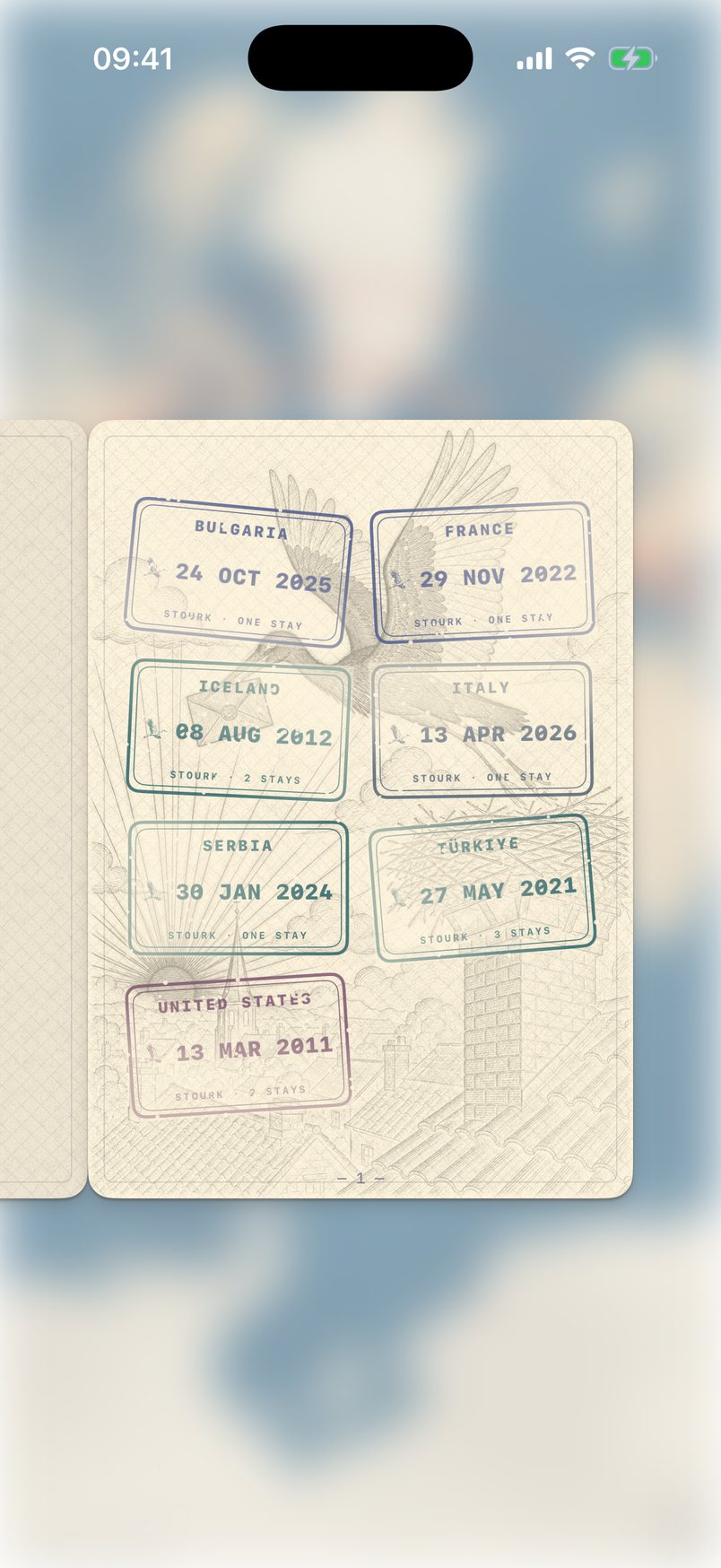An open passport with stamps on engraved pages
